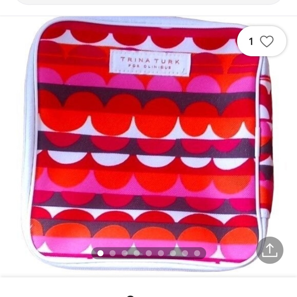 Used Tina Turks by Clinique make-up bag- has dark stain on back (see pictures)